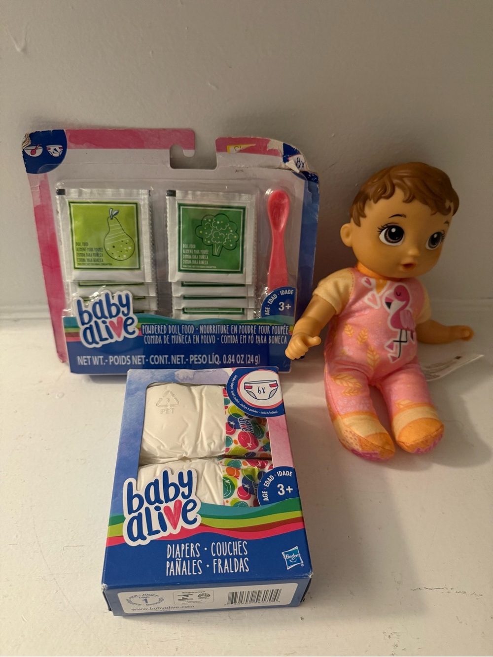 Baby Alive Doll Cute’n Cuddly Doll, New Diapers, and New Powdered Food Spoon Set